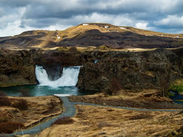 Hjálparfoss waterfall on a cloudy day
