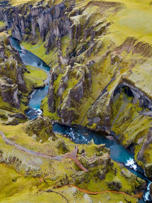 Aerial of Fjaðrárgljúfur surrounded by greenery