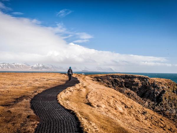 hikker walking the Hellnar-Arnarstapi coastal path