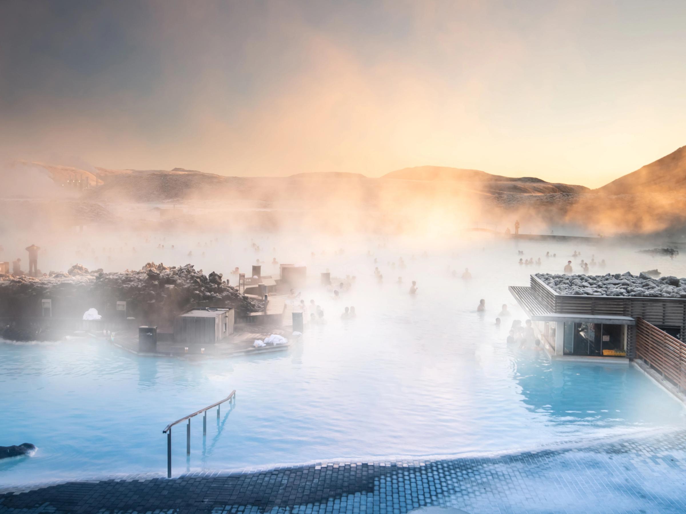 Aerial view of the Blue Lagoon in Iceland with people swimming in the warm waters