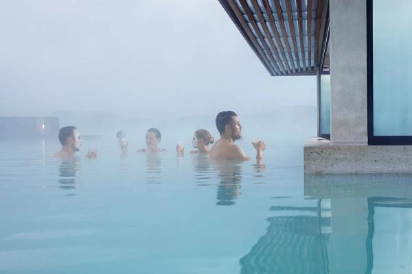 Man having a drink at the Blue Lagoon's in-water bar