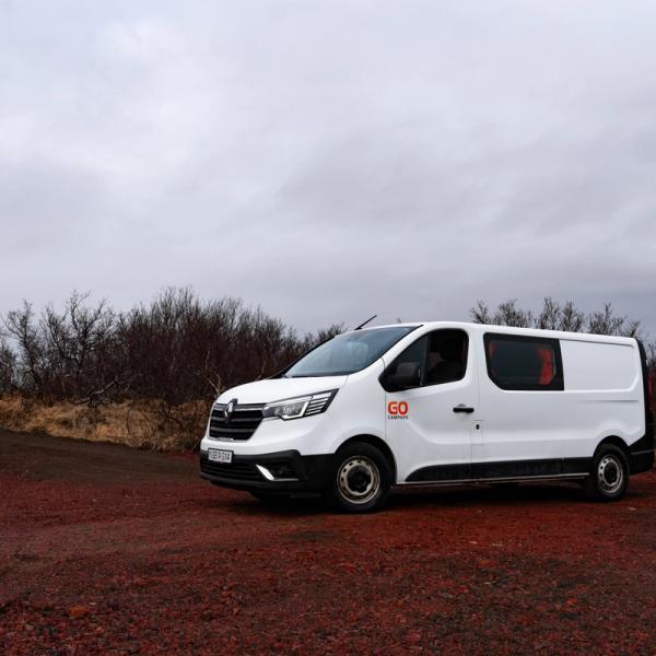 White van in Iceland on a gravel road