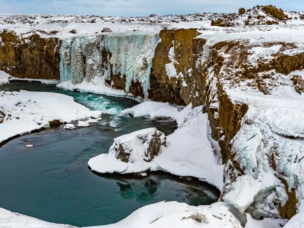 Hrafnabjargafoss Waterfall during winter