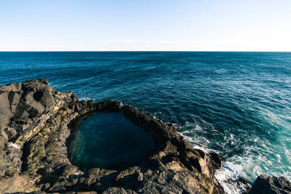 there is a small pool in the middle of the ocean .