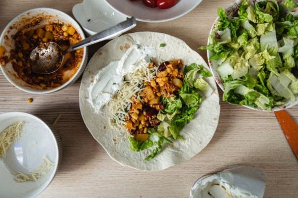 a table topped with plates of food and bowls of vegetables in iceland.