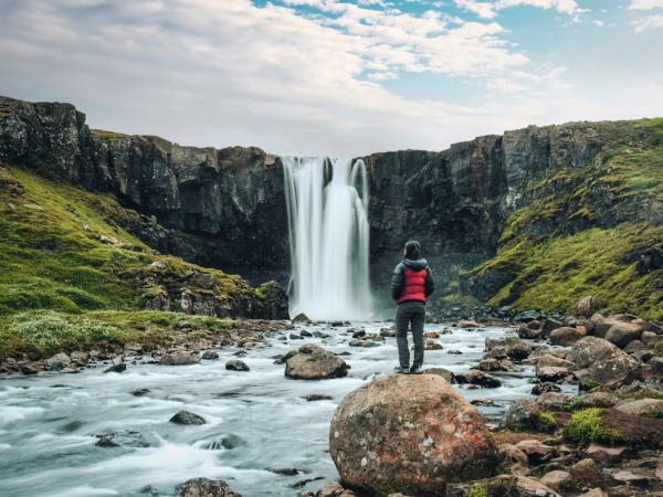 Hiker admiring Gufufoss