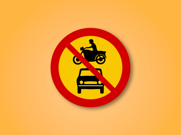 Red and yellow circle road sign with a rental car and a motorcycle in the middle. This road sign means No Motor Vehicles can enter.