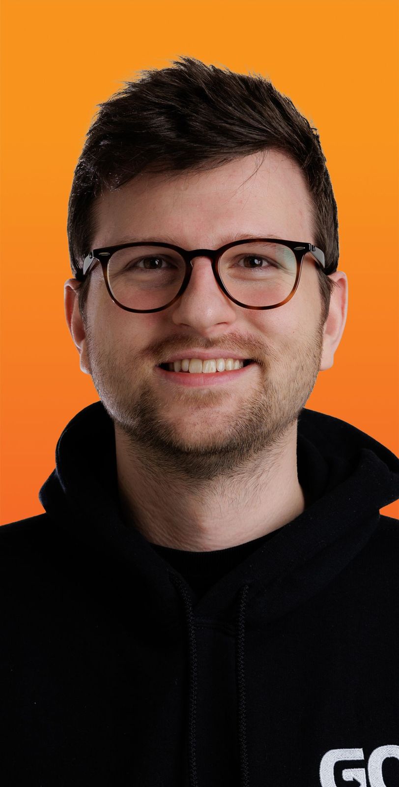 a man wearing glasses and a black hoodie that says go