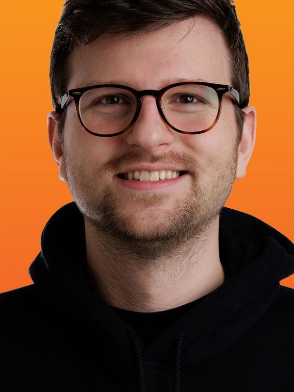 a man wearing glasses and a black hoodie that says go