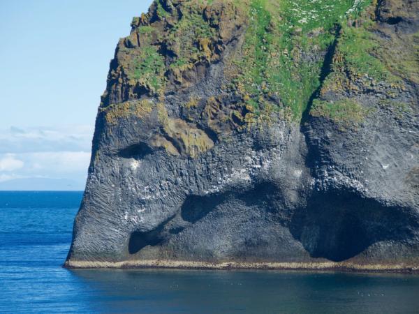 a rock shaped similar to an elephant in the water