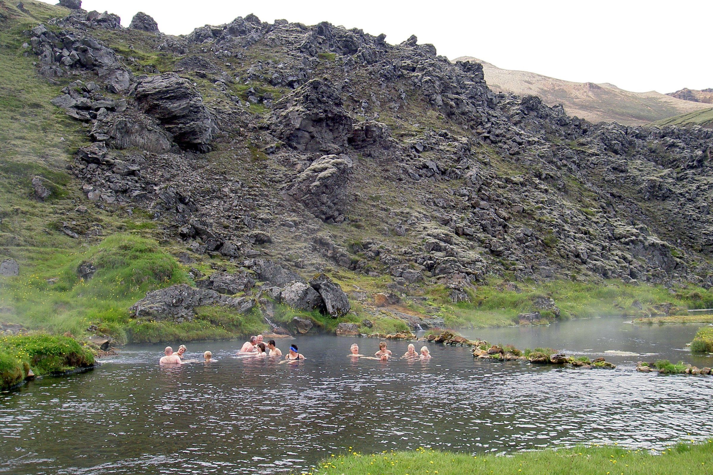Landmannalaugar People wearing swimsuits in a hot spring in Iceland