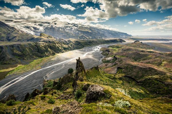 panoramic view of a valley with a thin river in the middle