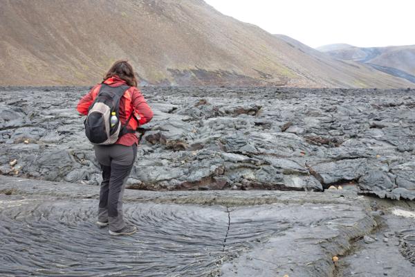 Hiker in iceland A hiker on the Fagradalsfjall eruption site