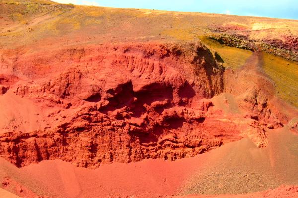 a large hole in the ground in the middle of a desert .