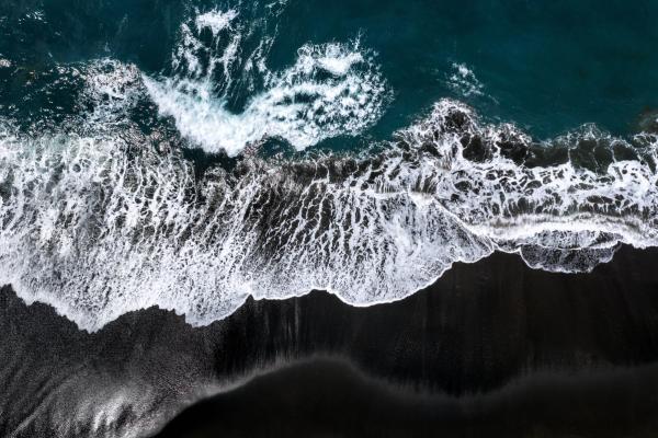 aerial view of a black sand beach