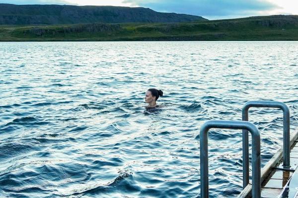 Girl swimming in Lake Urriðavatn