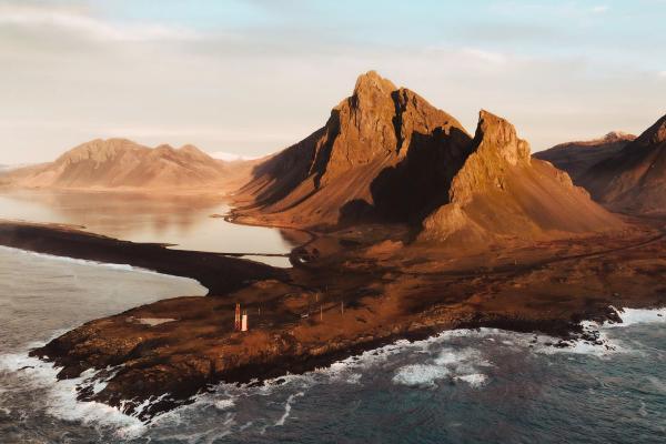 Lighthouse on Stokksnes cape nice view on the ocean, the lighthouse and a blue sky