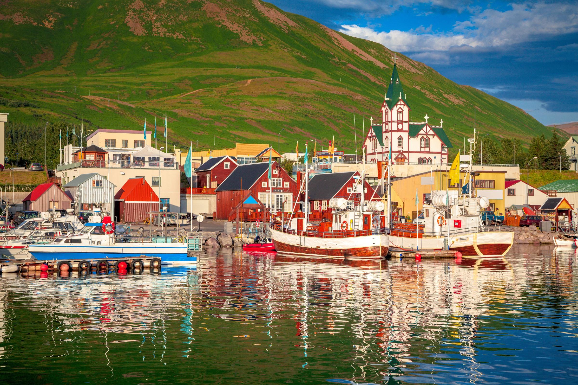 a coastal town with colorful wooden houses