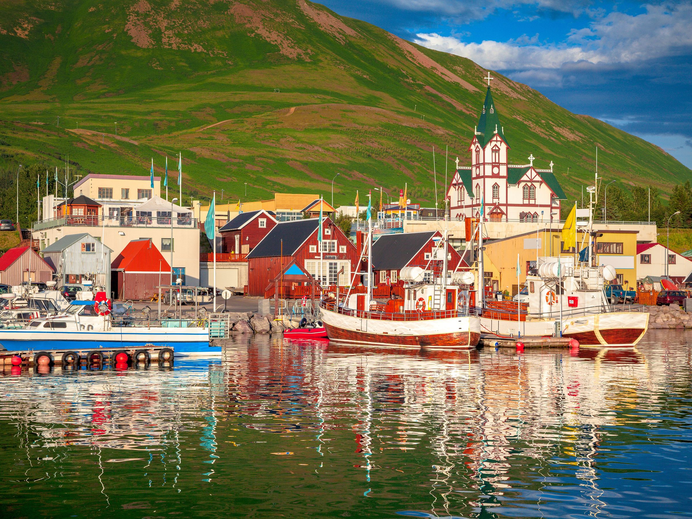 a coastal town with colorful wooden houses