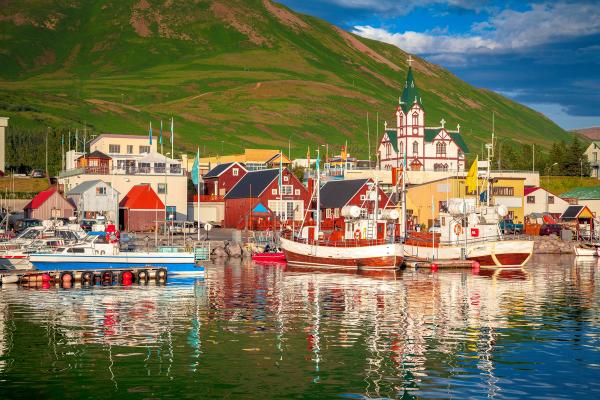a coastal town with colorful traditional wooden houses