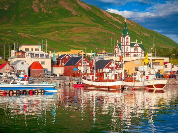 a coastal town with colorful wooden houses