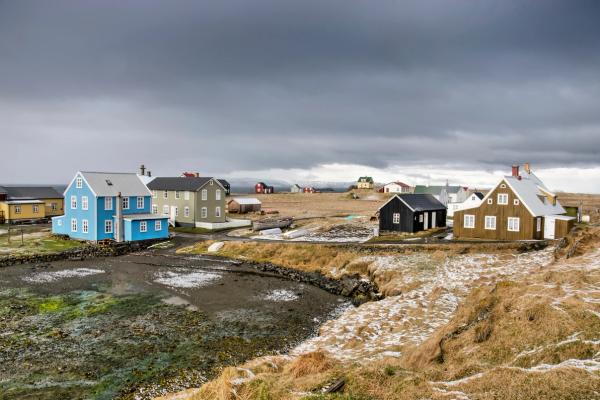Group of colorful houses under a cloudy sky