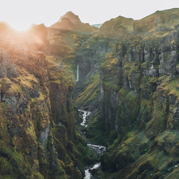 a river runs through a canyon between two mountains