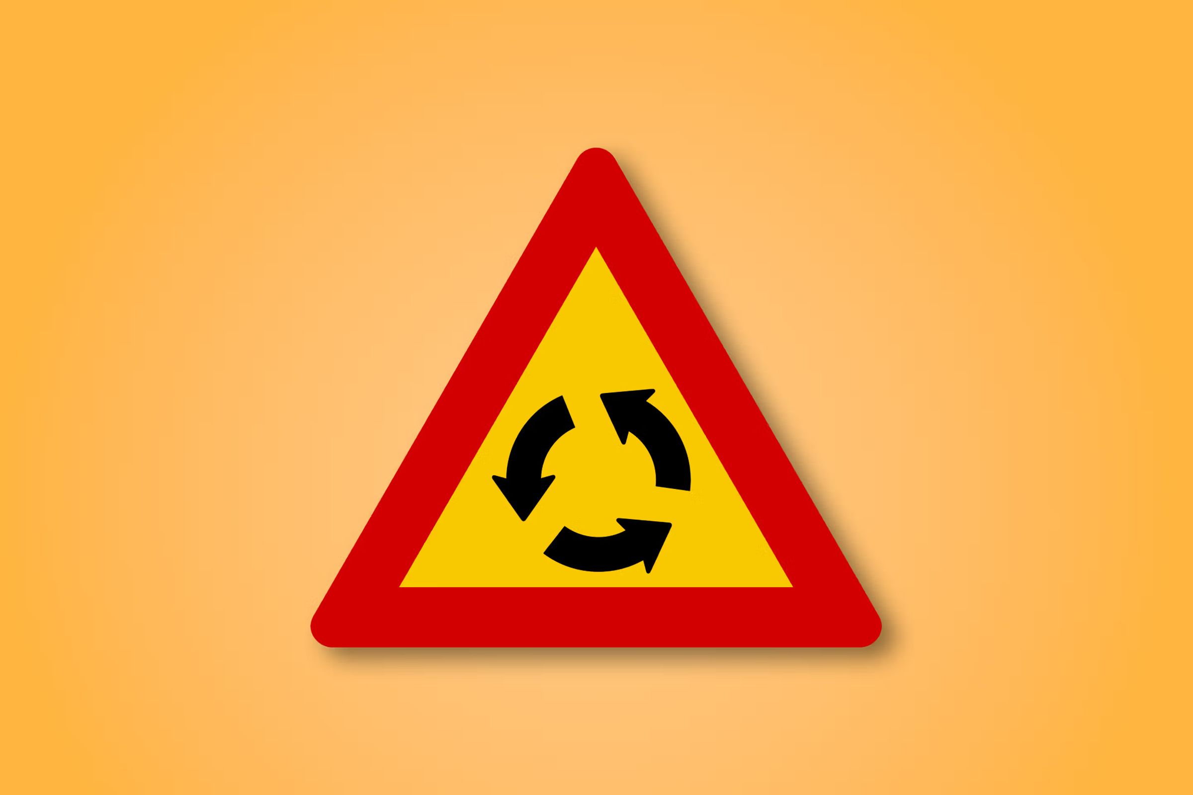 a yellow and red triangle sign with two arrows pointing in opposite directions on an orange background .