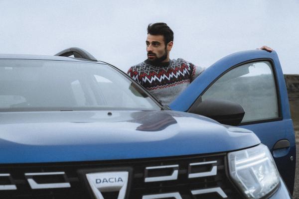 Driver in a Dacia Duster Driver entering is Dacia Duster