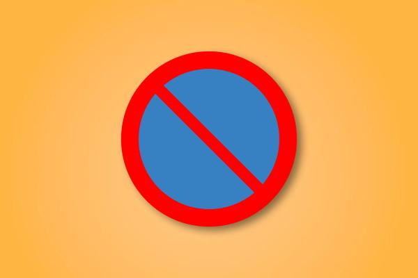 a red and blue circle with a red line through it on a yellow background .