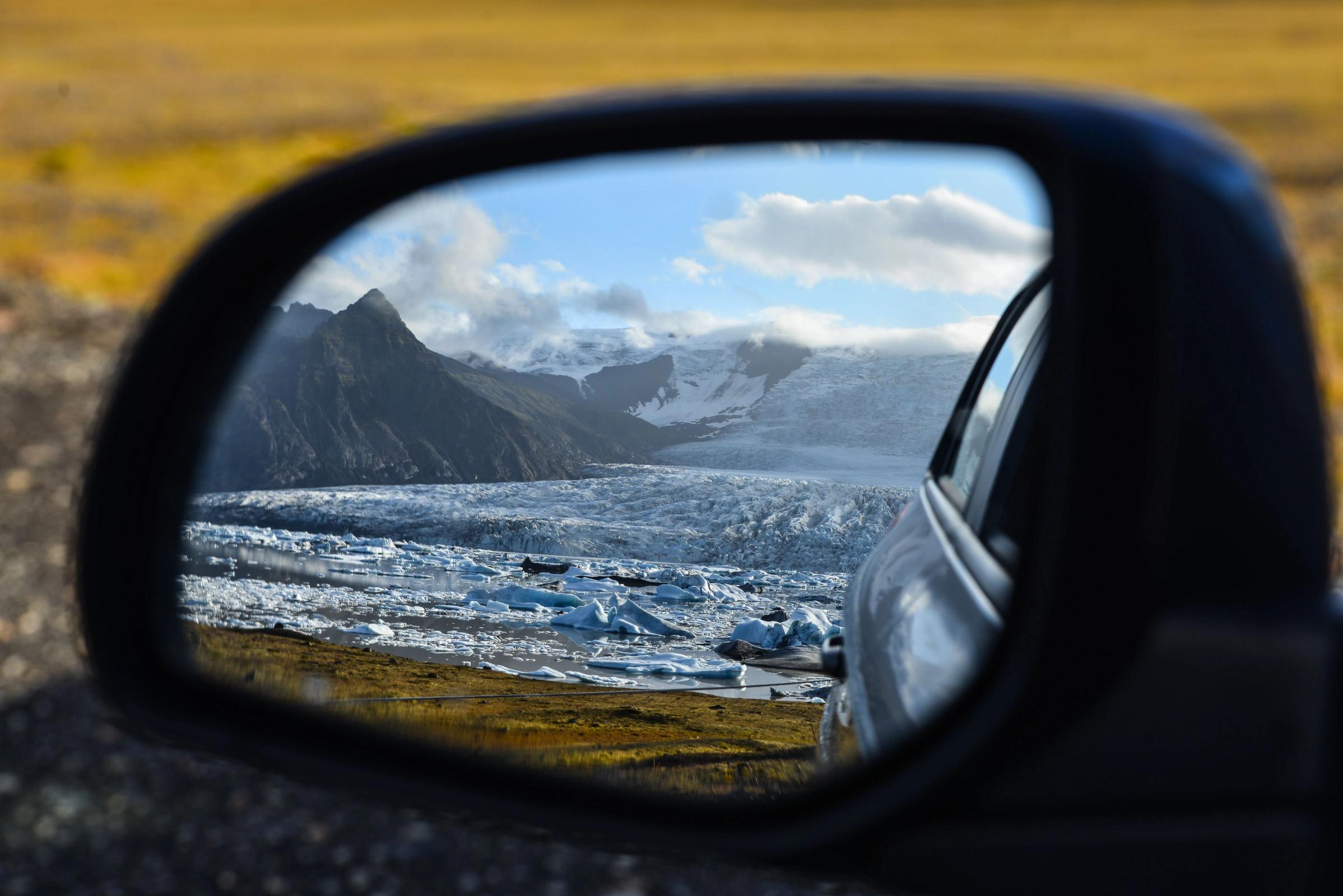Car rental mirror showing snow in may