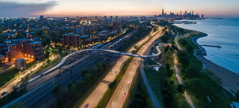 The 41st Street steel arch pedestrian bridge over Lake Shore Drive at dusk