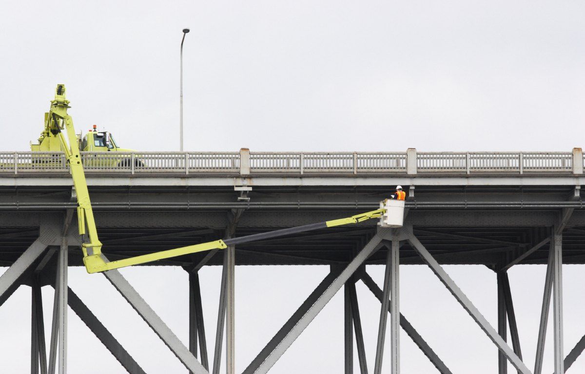 HBM engineers conducting a major bridge inspection from an under-bridge snooper truck