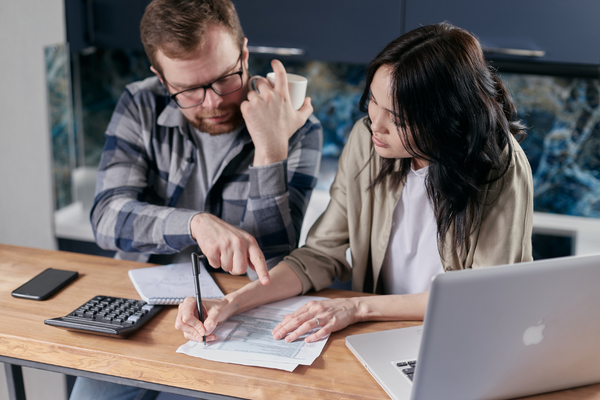 Couple sending invoices