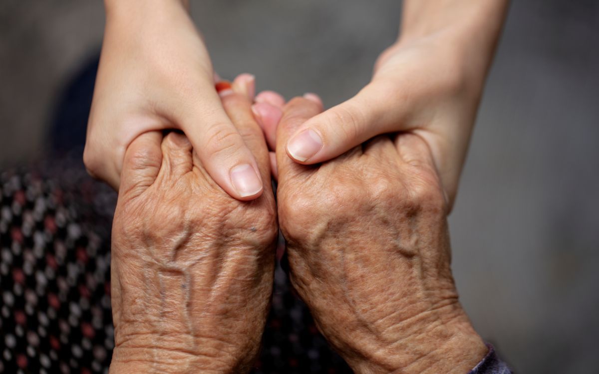 Elderly hands held