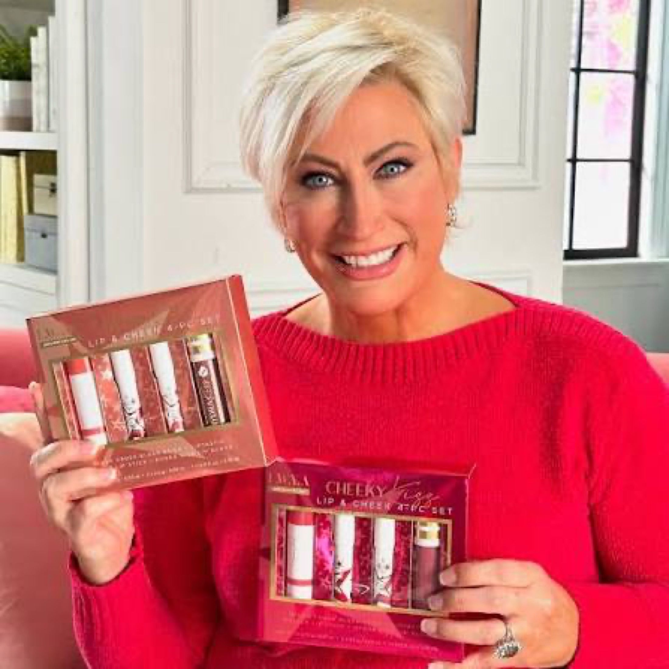 Kim Gravel holding an LWYA beauty kit