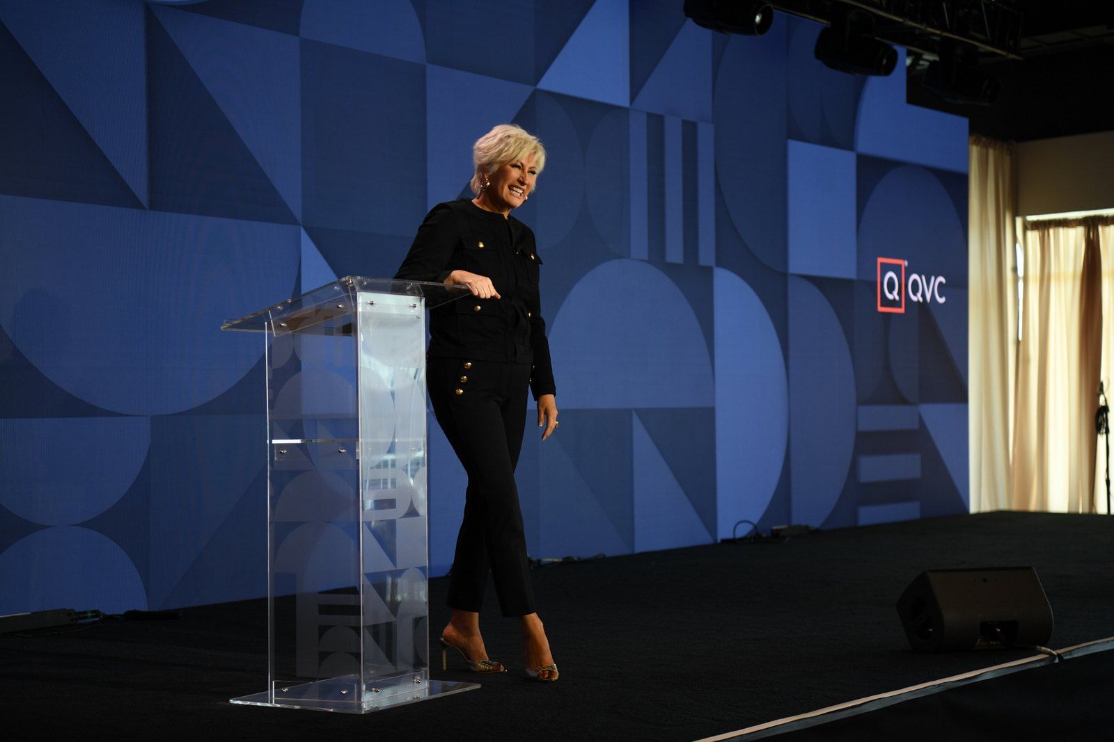 Kim Gravel at the podium on the QVC stage