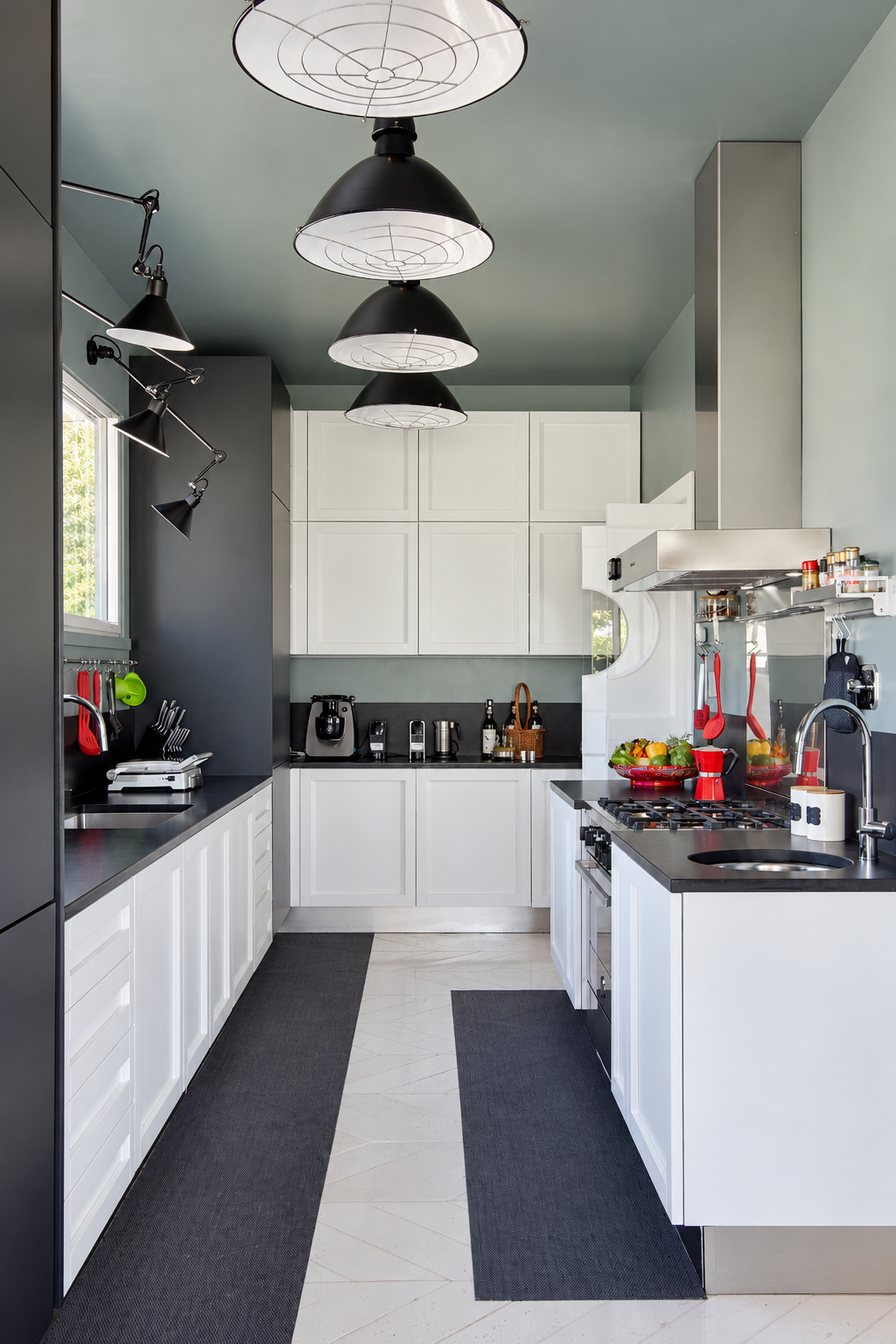 Kitchen with white cabinets and black industrial lamps