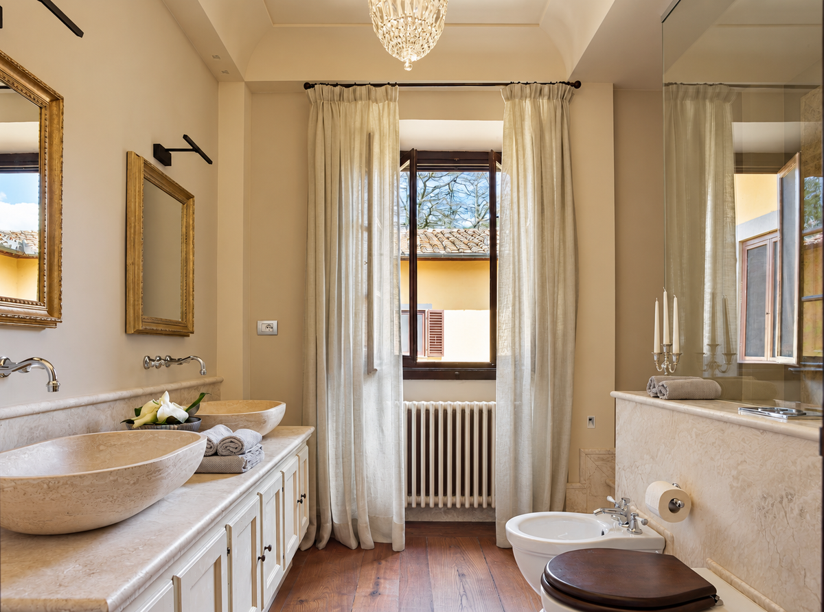 Bathroom in marble with stone basins and tall windows