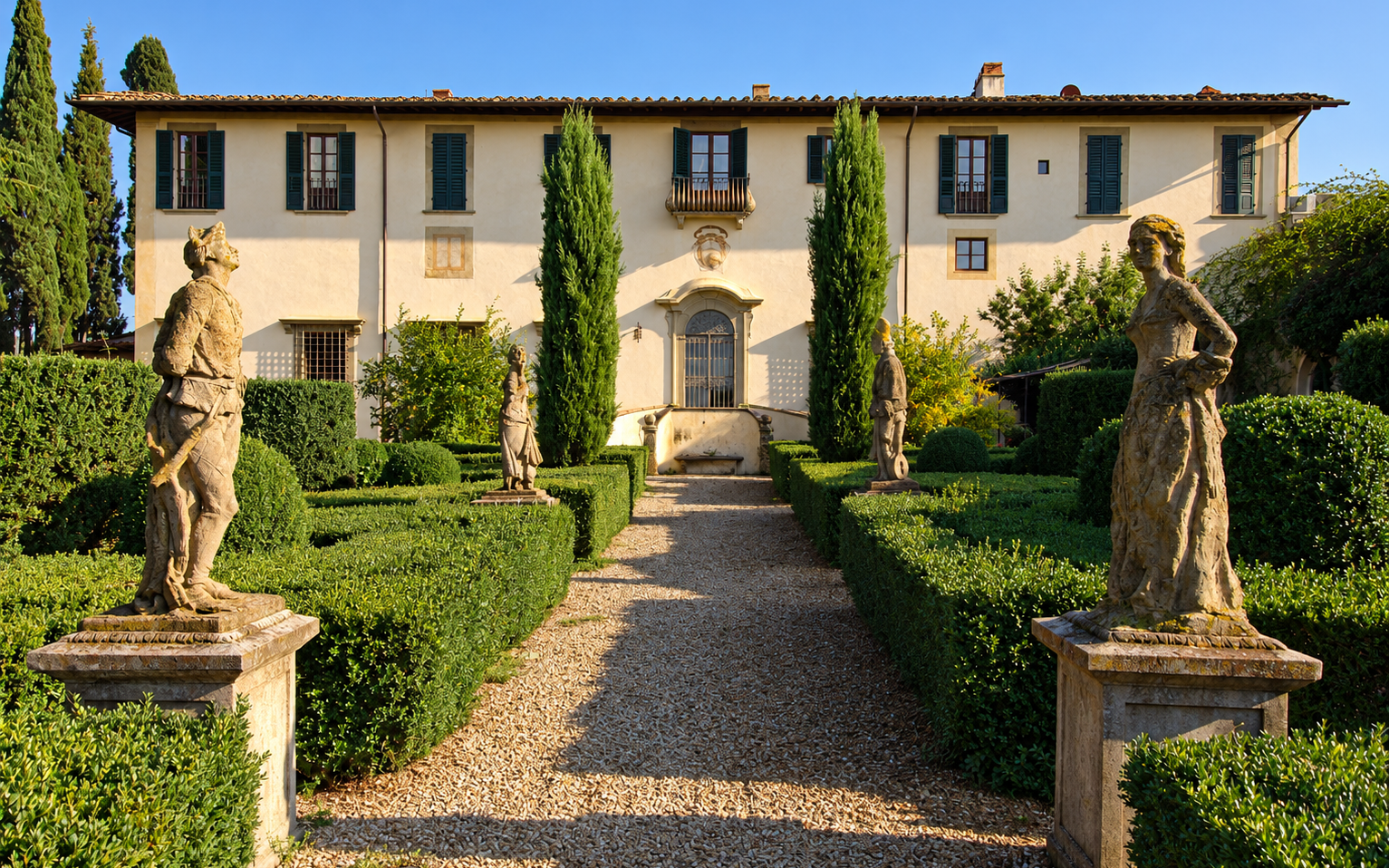 Villa Le Piazzole in Florence, its Renaissance facade beyond a formal Italian garden with statues