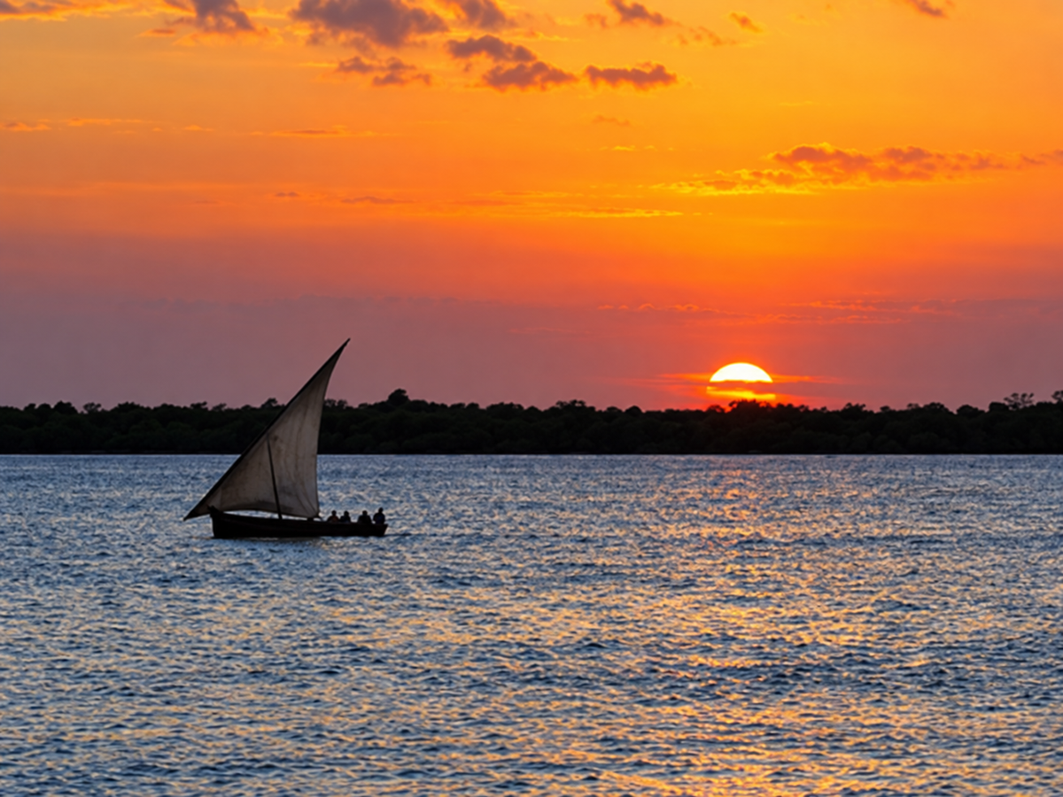 Dhow silhouetted at sunset
