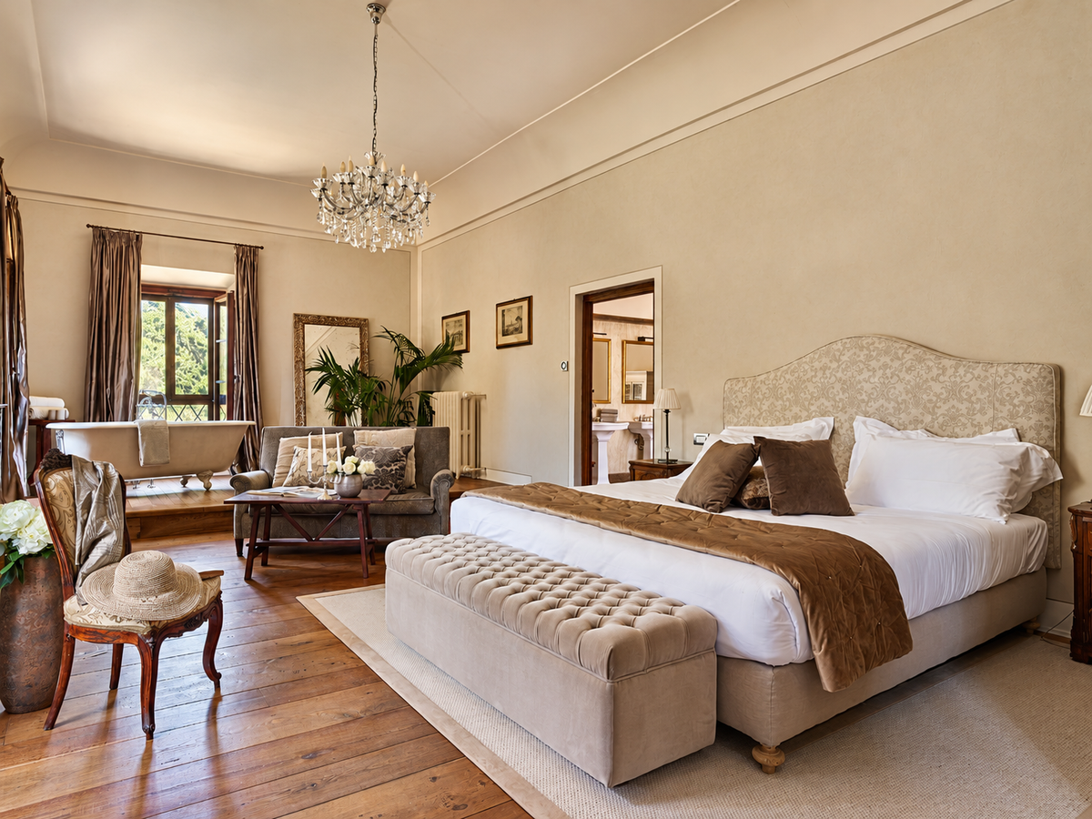 Medici Suite with a chandelier and a bathtub by the window