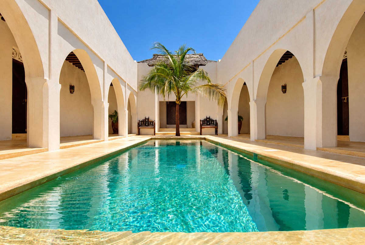 Long pool between white Swahili arches