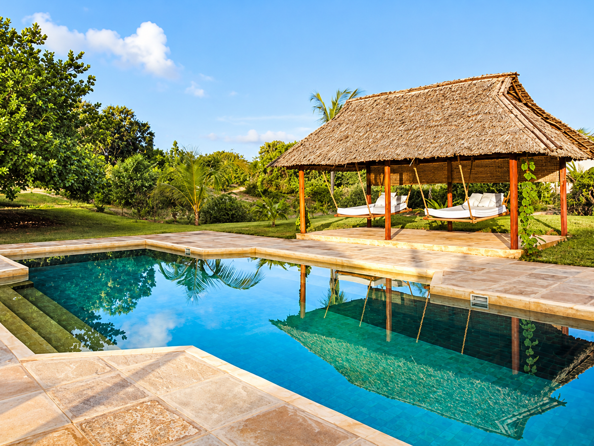 Garden pool with a thatched hammock pavilion