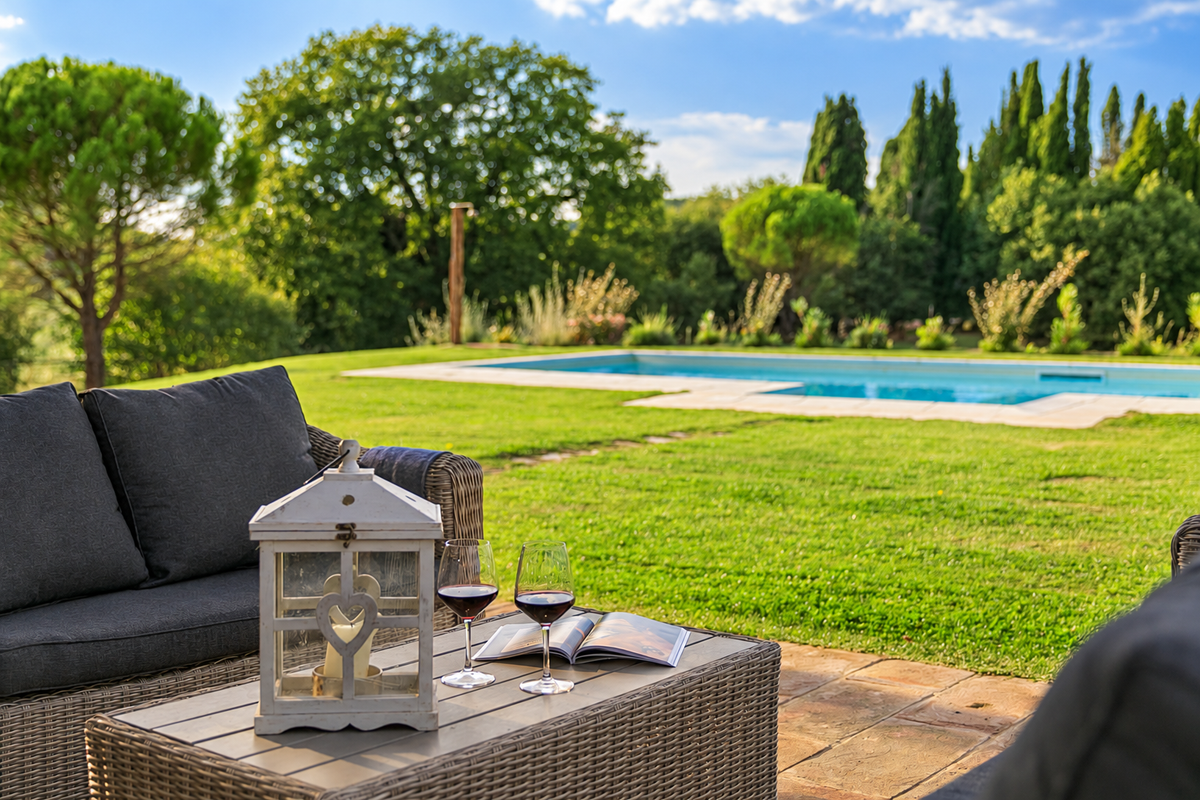 Wine by the pool with a lantern