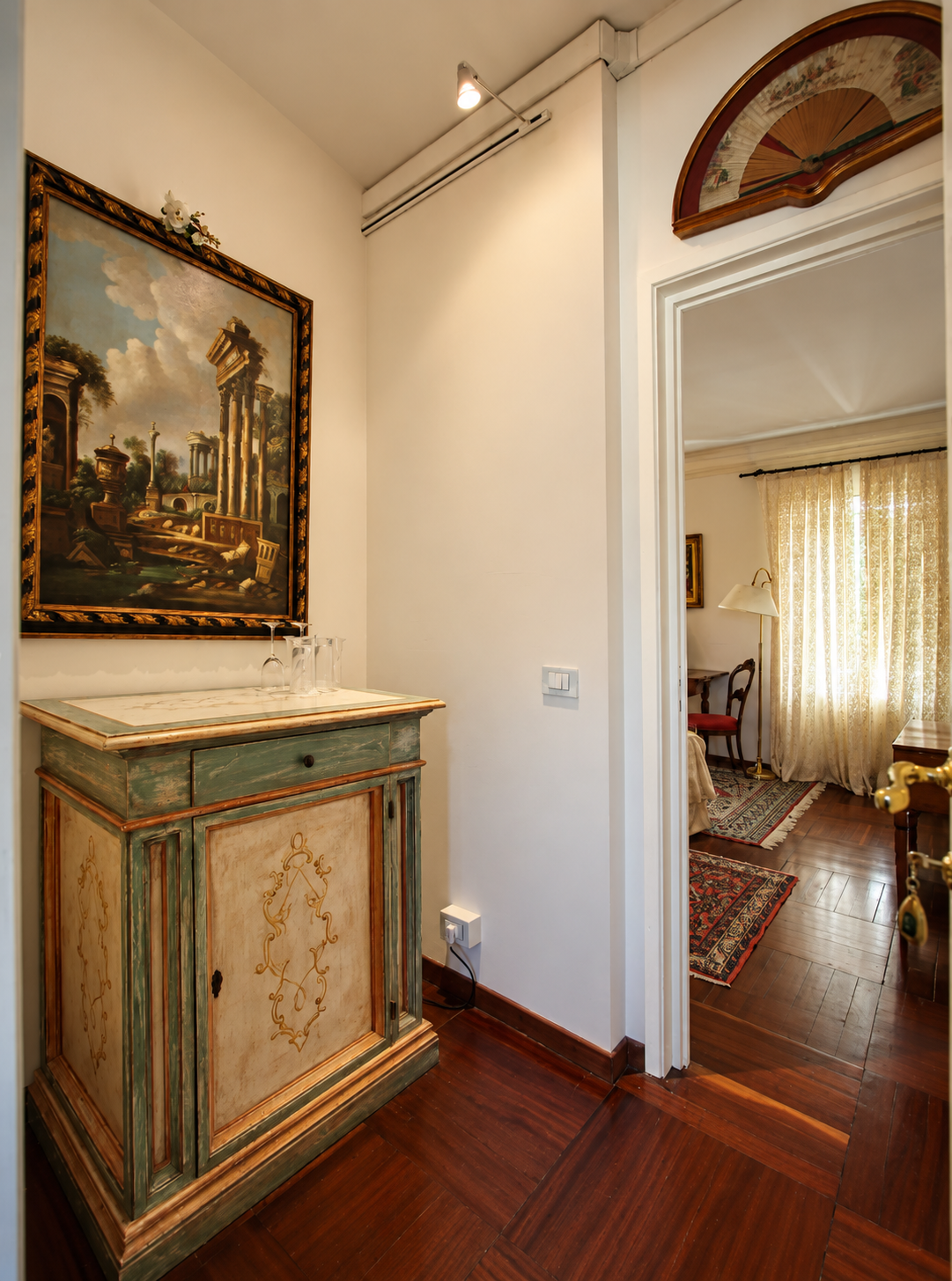 Historic corridor with a classical painting and painted cabinet