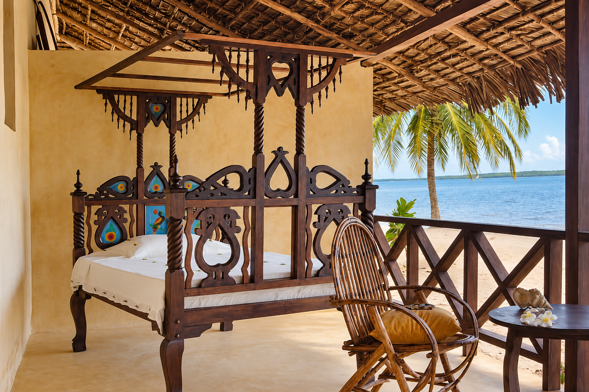 Carved Swahili four-poster daybed facing the ocean