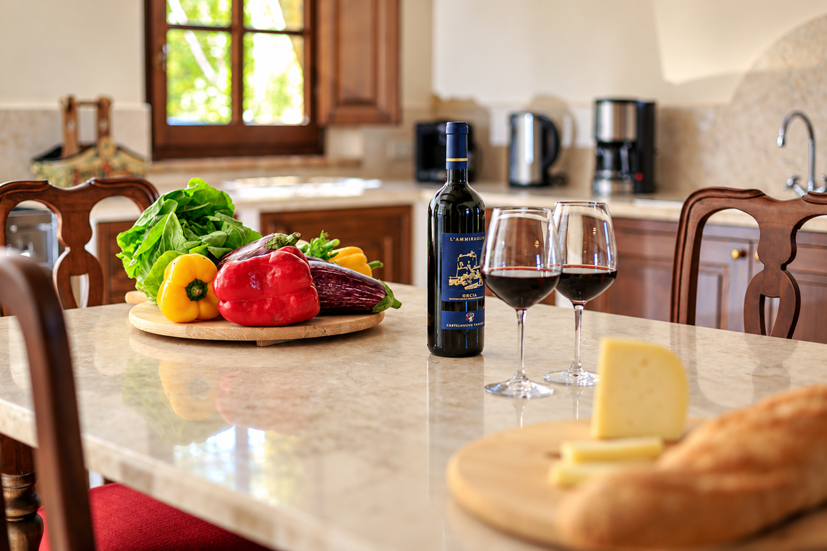 Tuscan wine and fresh produce on the kitchen table