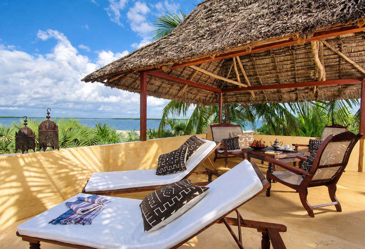Thatched ocean-view terrace with loungers