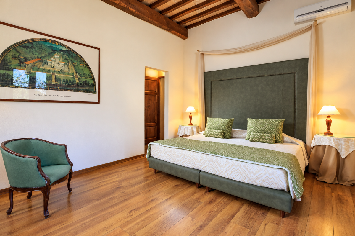Green bedroom with a beamed ceiling